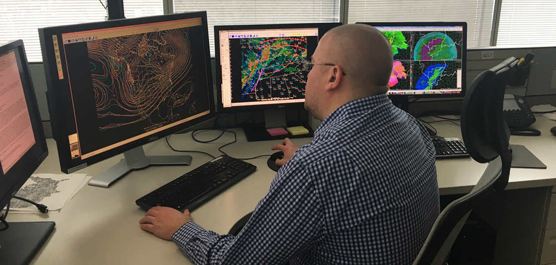 Weather Prediction Center Meteorologist Andrew Orrison works with weather model data