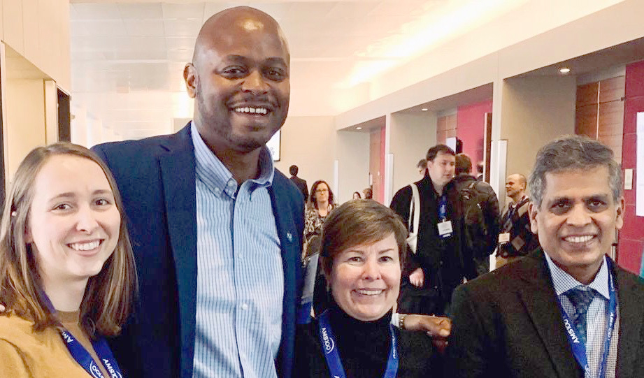 Current and former EPIC team members at a conference. From left to right: Leah Dubots, DaNa Carlis, Cathy Lapenta, Krishna Kumar.