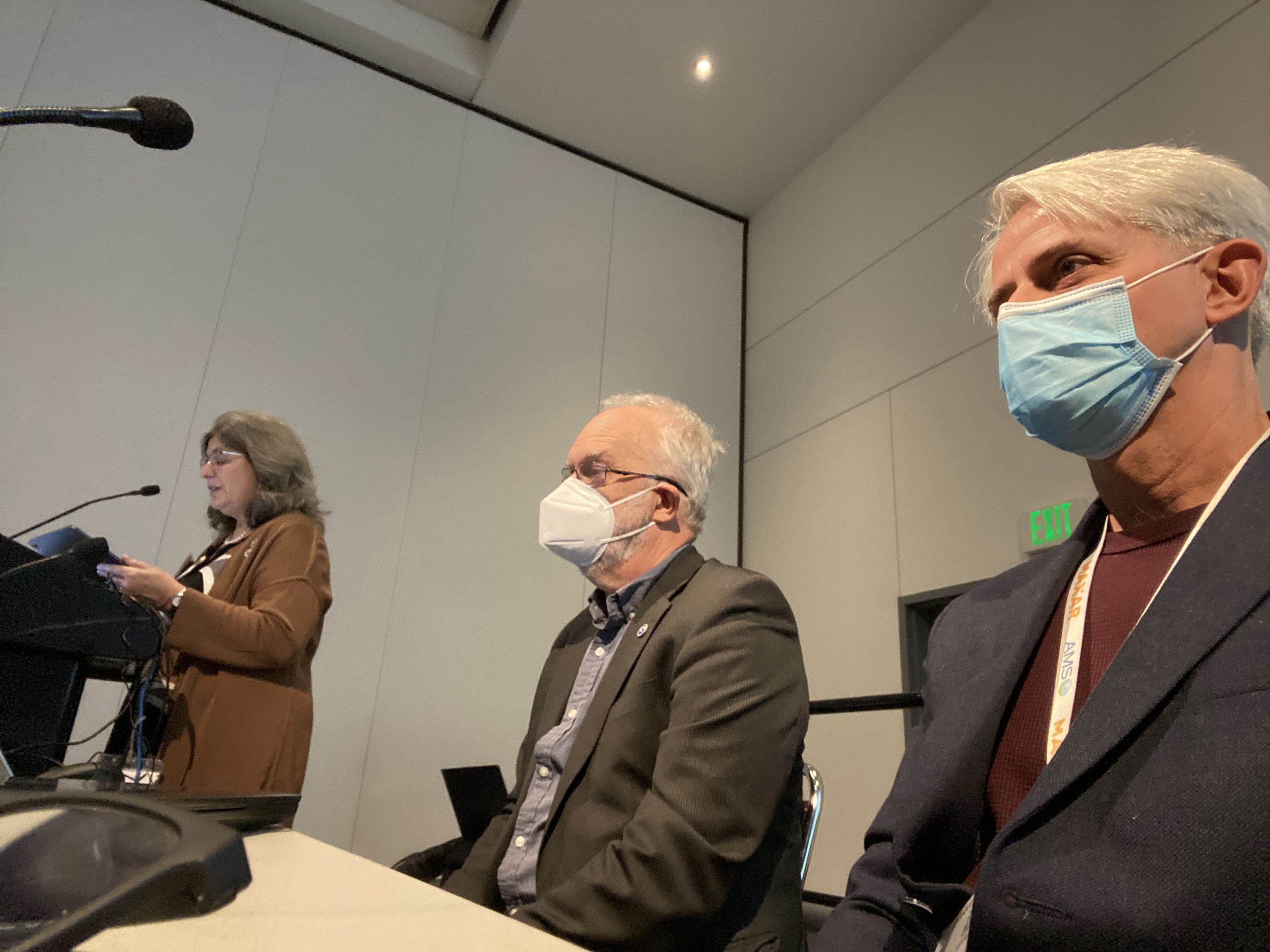 Mary Erickson, Deputy Director of the National Weather Service, presenting during the EPIC Town Hall with moderators Hendrik Tolman (left) and Jose-Henrique Alves (right) onstage.