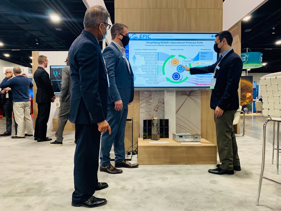 Keven Blackman and Chris Domanti presenting to Dr. Krishna Kumar at the Raytheon Technologies EPIC Demonstration station.