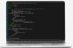 Open laptop with code editor running on screen