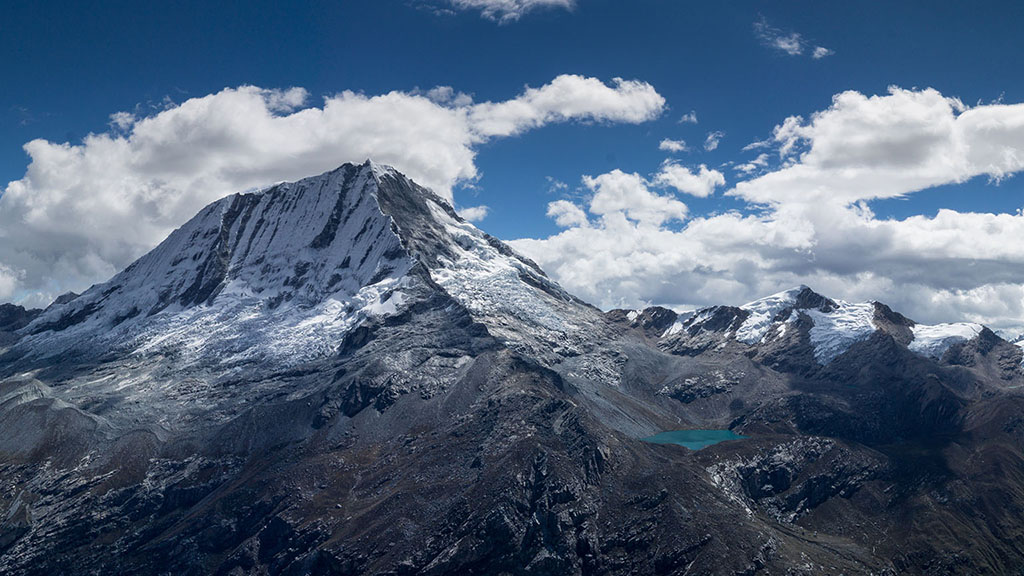 Panorama image of the mountains with snow caps